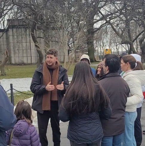 Liam O'Brien leading a tour group